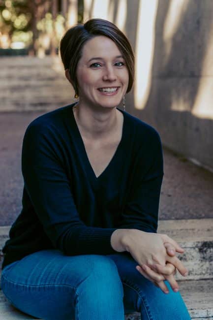 A Licensed Marriage and Family Therapist sitting down outside in Fort Worth, TX