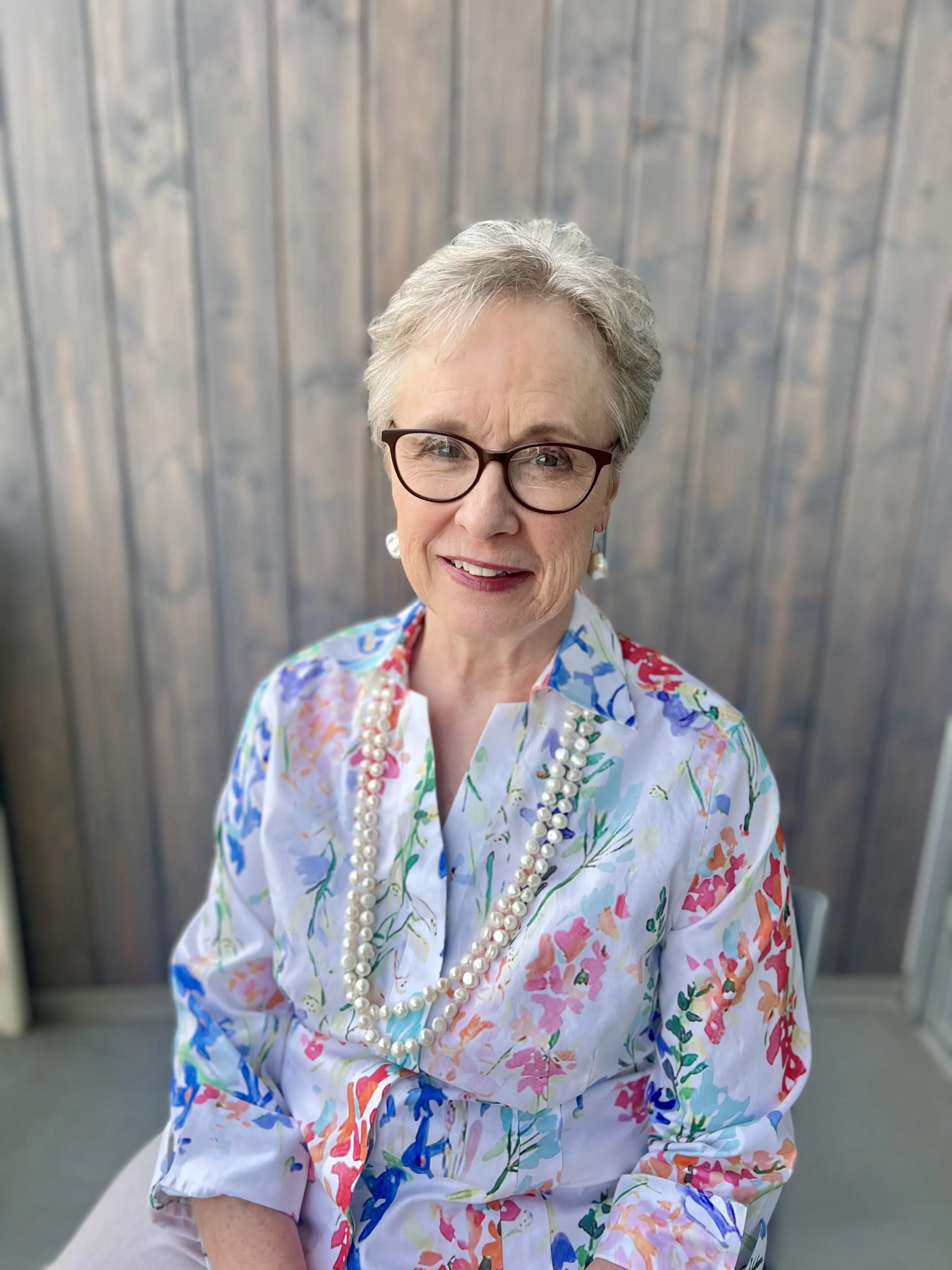 Elaine Garrison sitting in a chair at Fort Wellness Counseling in Fort Worth, TX.