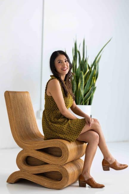 A Licensed Marriage and Family Therapist sitting on a chair.