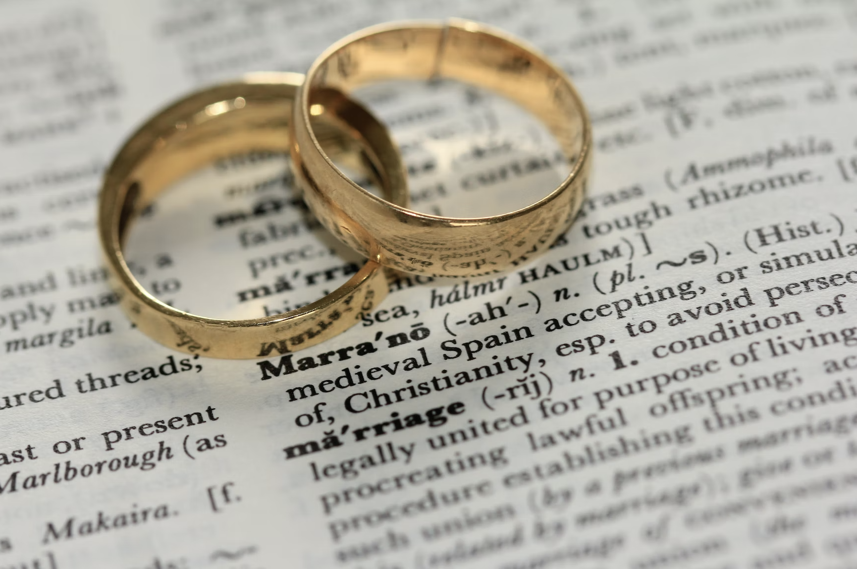 2 Wedding Rings on a newspaper