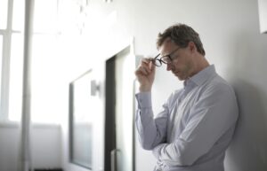 a man against a wall overthinking